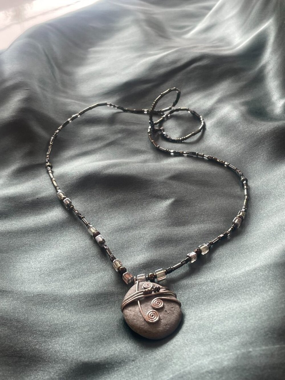 Unique beaded stone necklace with silver trim